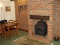 High Farm, holiday cottage accommodation, Pickering; fireplace in cottage